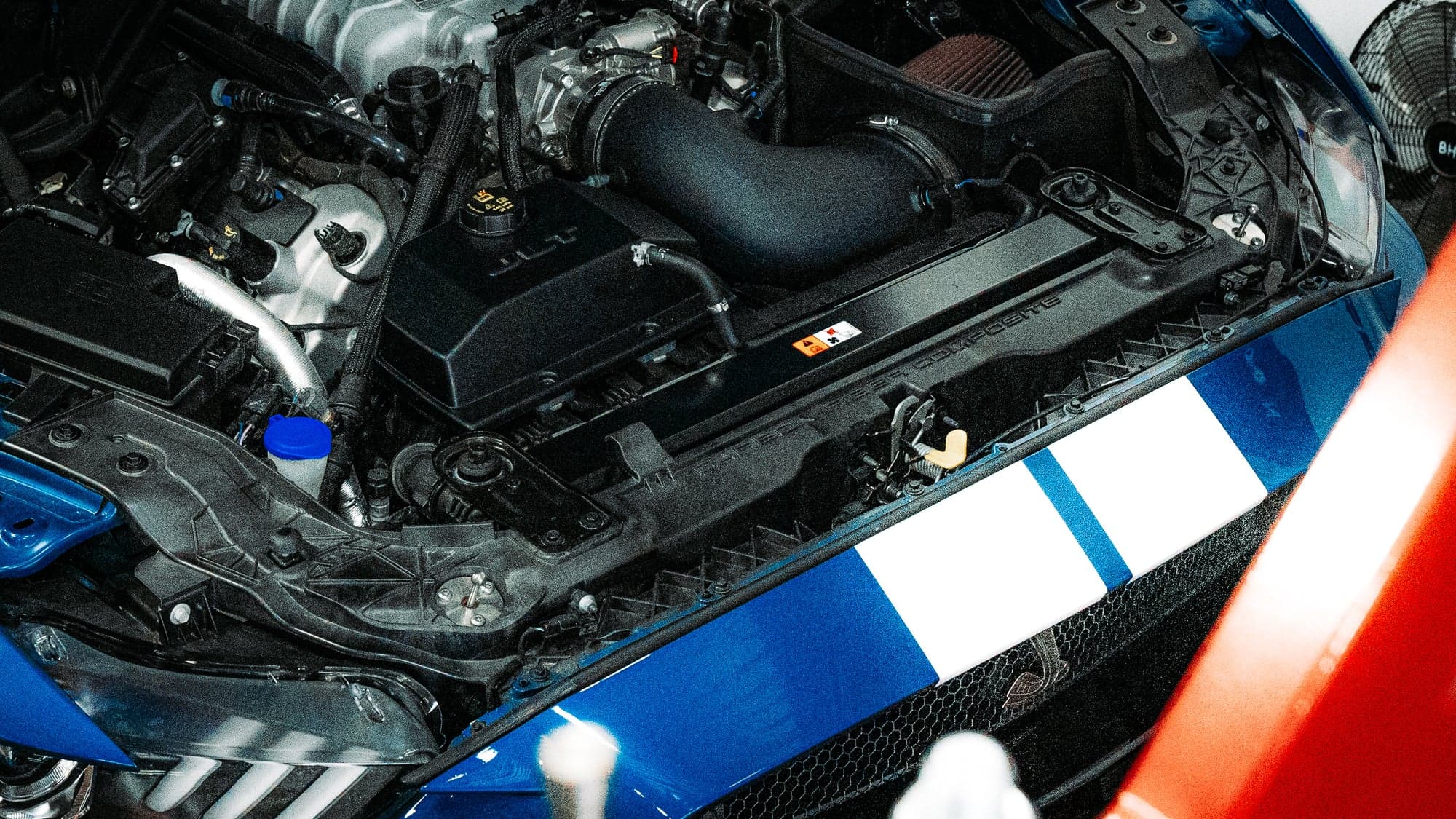 Supercharged engine bay of a build in progress at APA Custom Shop